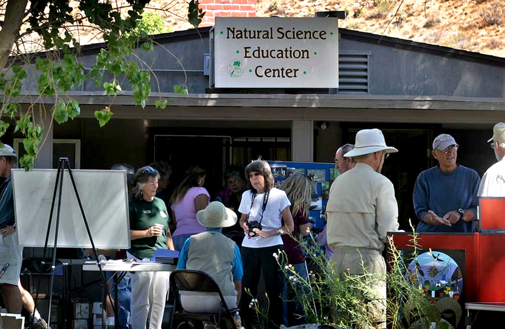 People standing in front of the Natural Science Education Center at Big Morongo Canyon Preserve.
