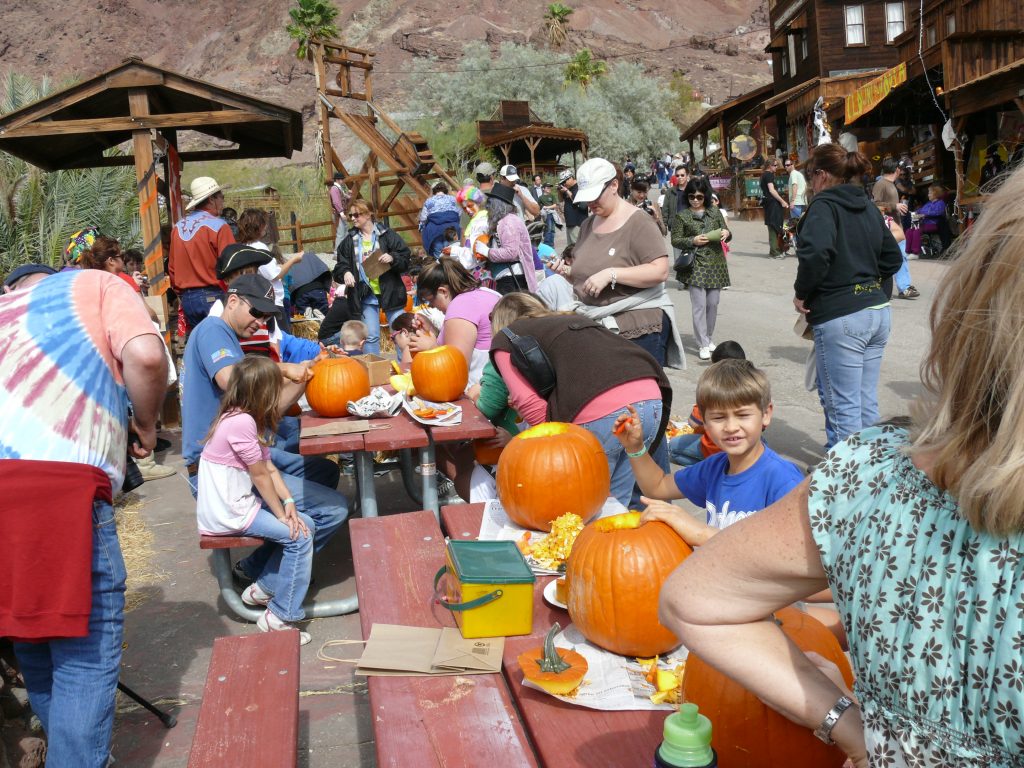 Calico Ghost Town visitors carving pumpkins