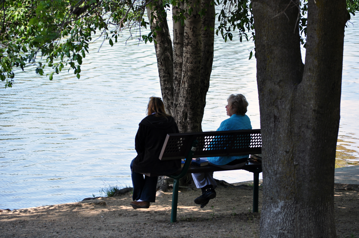 ladies on a bench by the lake