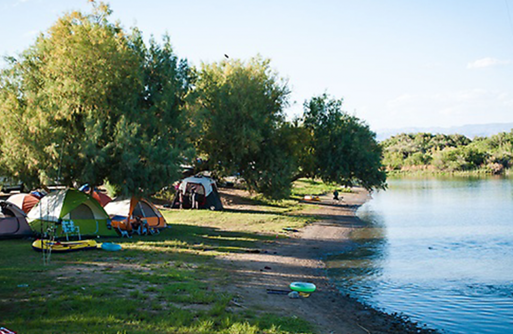 tents lined up on the shore of the peninsula of Moabi.