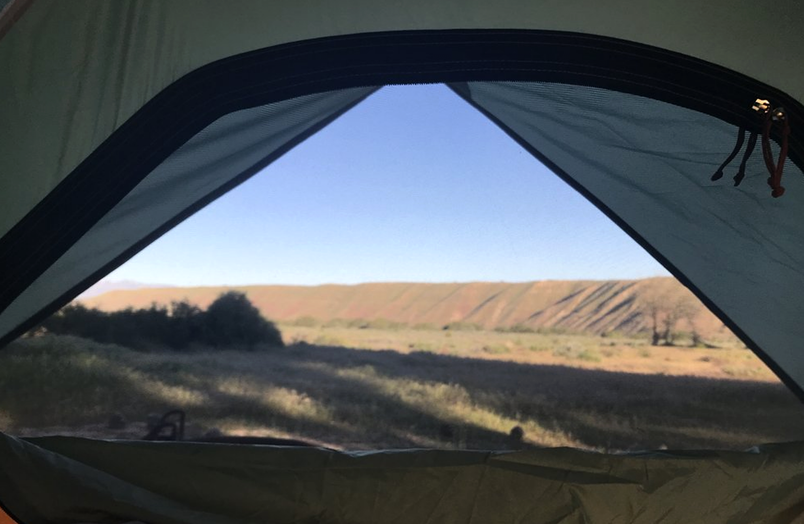 A view from inside looking out in a open tent at Mojave River Forks.