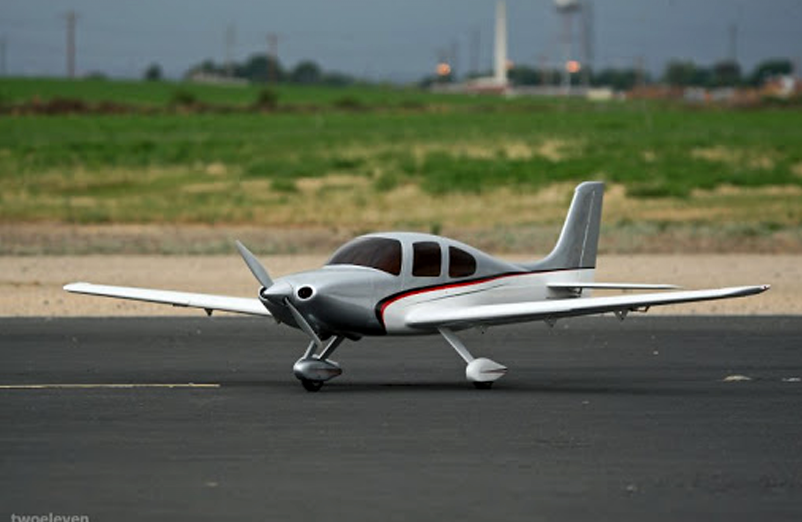 A model airplane on the runaway at Prado park airfield.