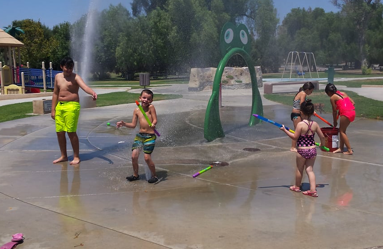 Children play at Prado splash pad.