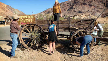 Volunteers at Calico standing near a wagon