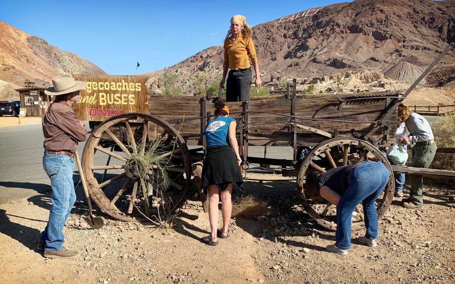 Volunteers at Calico standing near a wagon