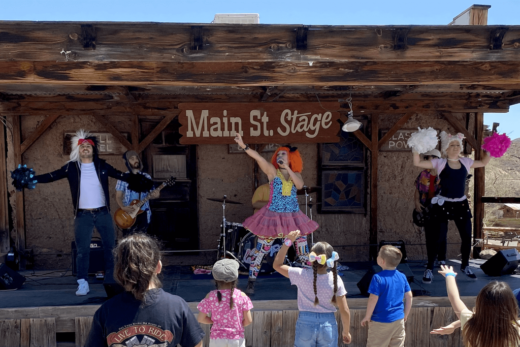 A children's performer sings on stage during Easter 2022 at Calico Ghost Town.