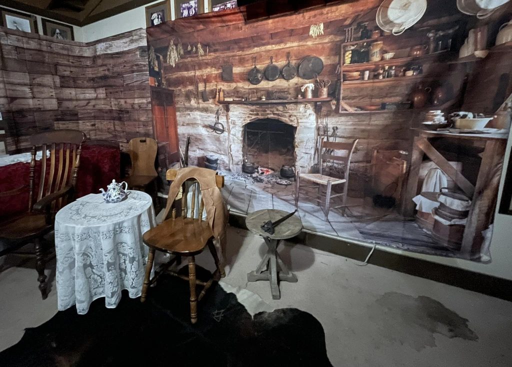 A stage of a Victorian living room is set up at Calico Ghost Town for a theatric performance.