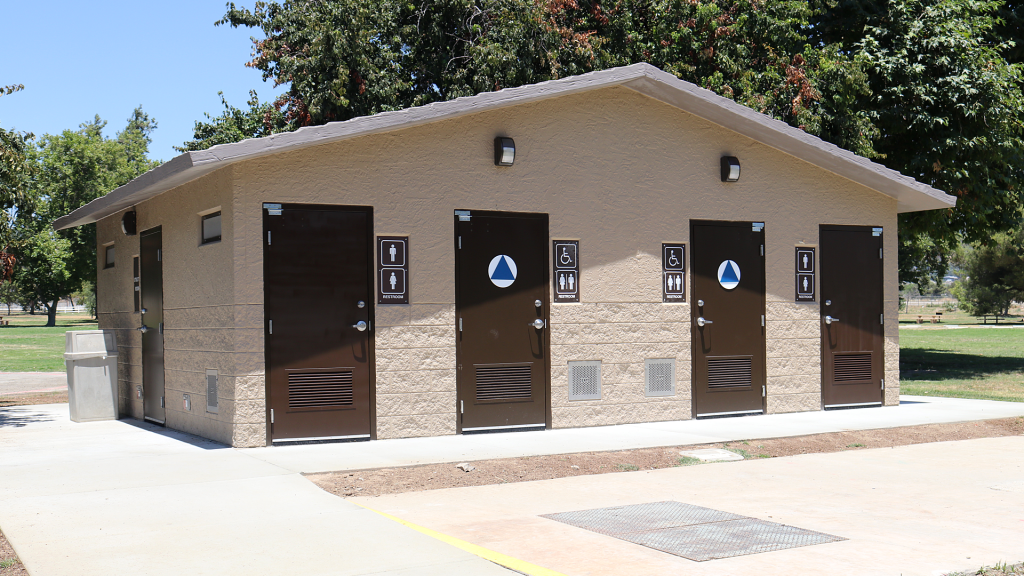 A photo of a brown concrete restroom that in newly constructed ADA compliant at Glen Helen Regional Park.