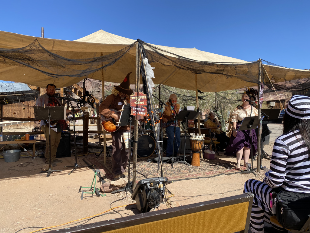 A group of musicians in a band dressed in Halloween costumes for Calico Ghost Haunt in 2023.