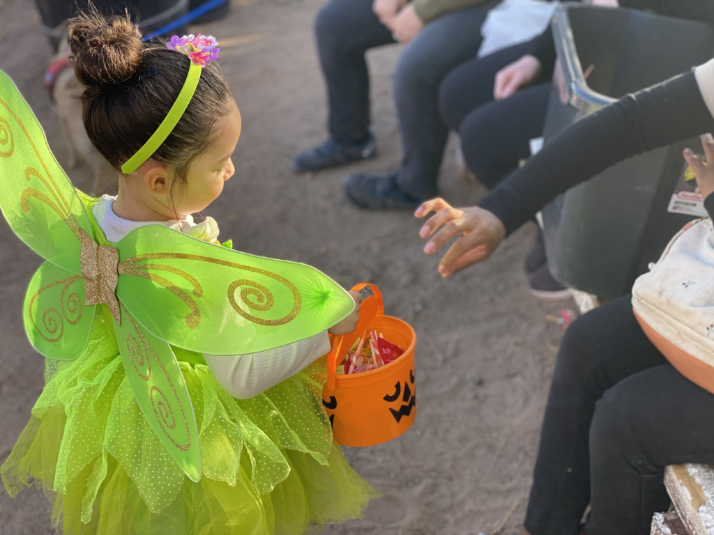 A little girl dressed up a a s fairy is trick or treating at Calico Ghost Town Ghost Haunt in 2022.