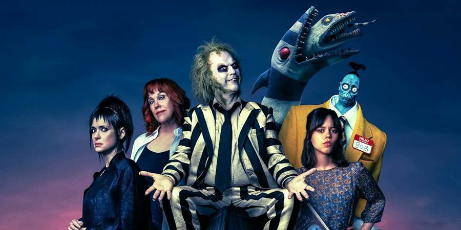 Five actors dressed in Halloween costumes for the movie Beetlejuice Beetlejuice.