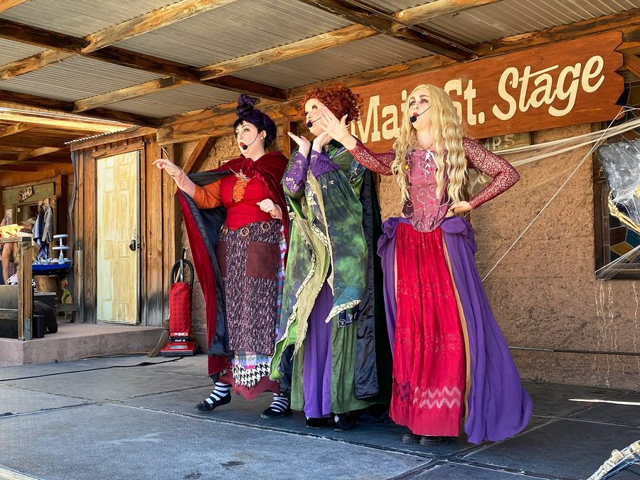 Three women in costume dressed like the Sanderson Sisters from Hocus Pocus movie perform on the Main Street Stage at Calico Ghost Haunt.