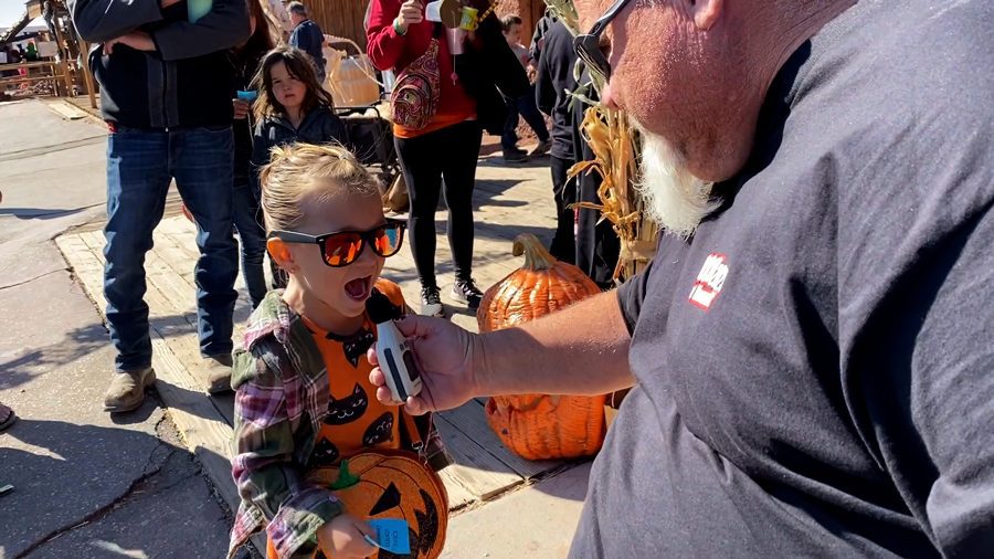 A little girl screams into a microphone at Calico Ghost Haunt.