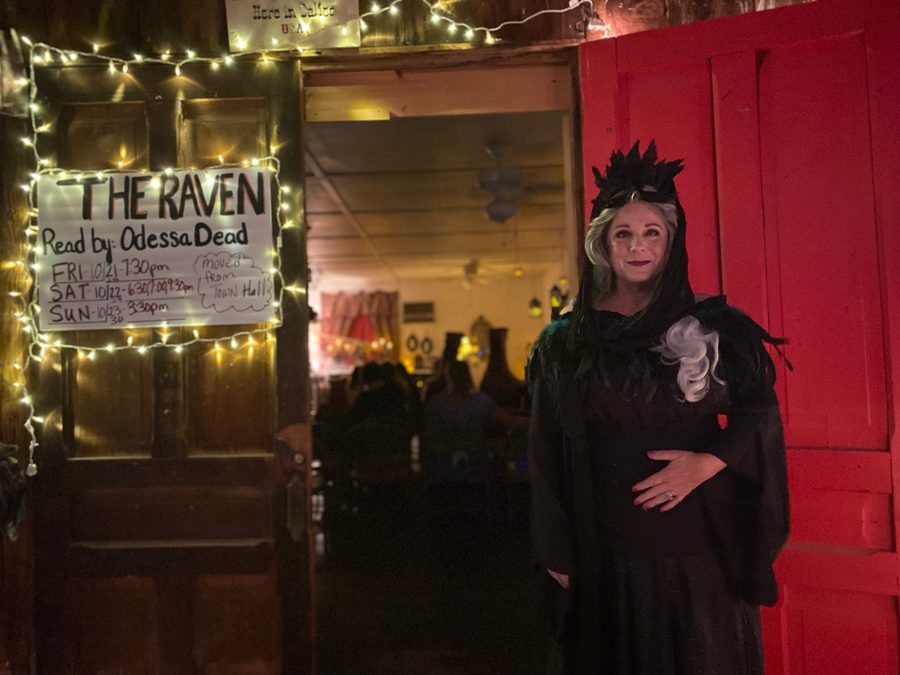 A women dressed in black cape and hat at Calico Ghost Haunt.