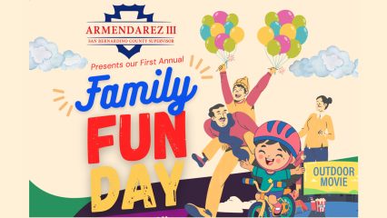 The illustration features a smiling family enjoying outdoor activities, including a child riding a bicycle, colorful balloons, clouds and an outdoor movie screen. Large text reads, Presents our First Annual Family Fun Day.