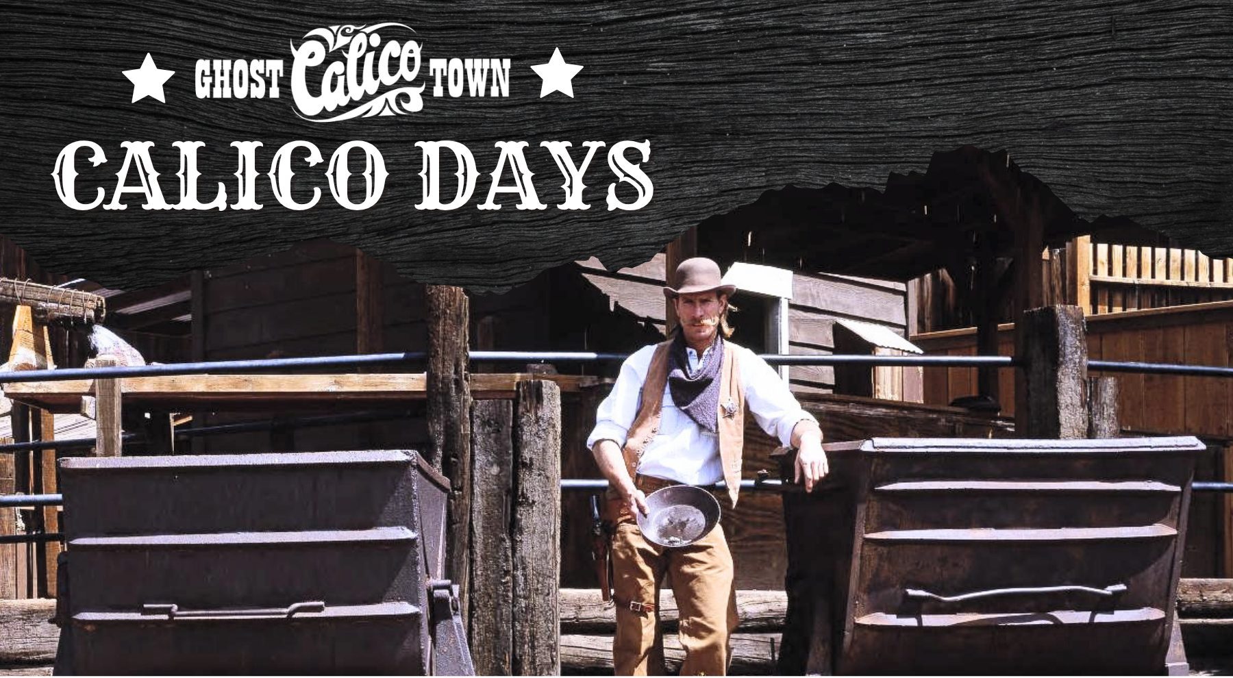 A man dressed in Western wear stands while holing a mining pan at Calico Ghost Town.